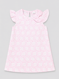 A light pink sleeveless dress for a toddler girl, featuring a delicate white floral pattern, ruffled cap sleeves, and a matching fabric bow on the chest, shown flat on a neutral gray background.