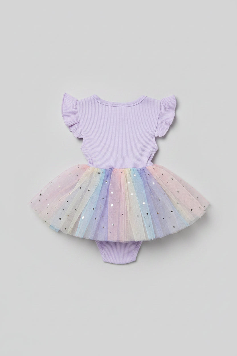 Back side of a baby girl's off-the-shoulder bodysuit with a pastel rainbow tulle tutu skirt and star embellishments.