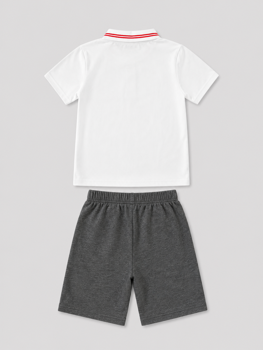 Boys white polo shirt with red striped collar and charcoal gray shorts two-piece set, back view, size 6Y.