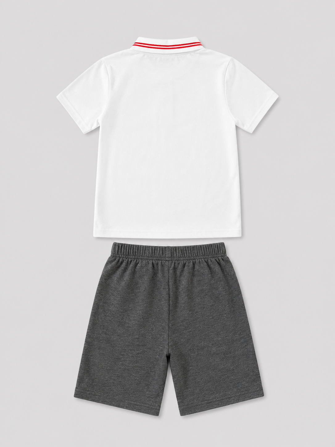 Boys white polo shirt with red striped collar and charcoal gray shorts two-piece set, back view, size 6Y.