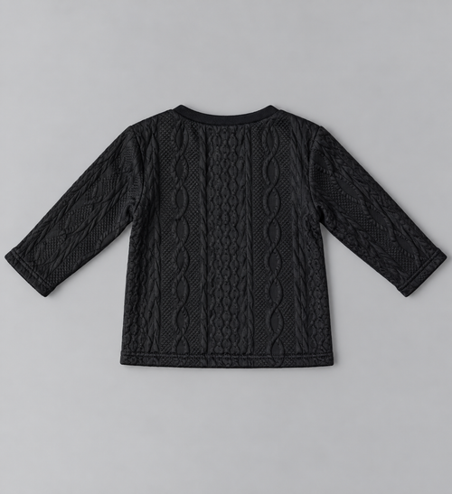 Back view of black kids long-sleeve cable-knit textured top with allover raised cable pattern