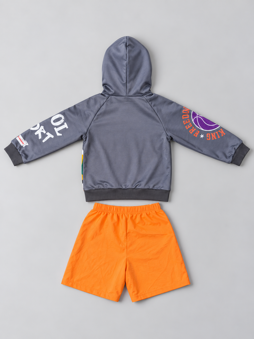 Kids gray basketball graphic hoodie and orange shorts two-piece outfit, back view