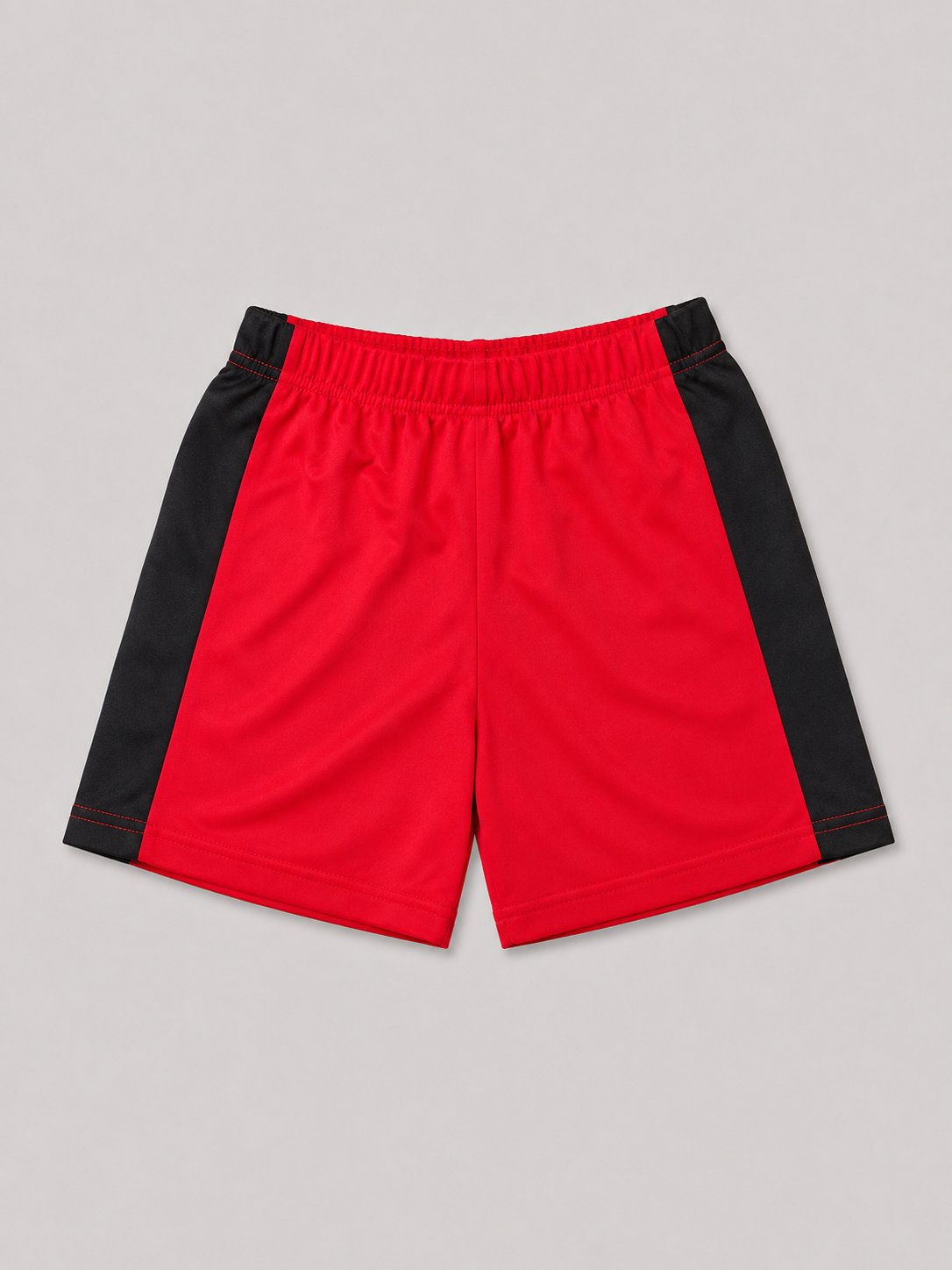 Red and black athletic-style kids' shorts featuring an elasticized waistband and sporty color-blocked design. Comfortable pull-on shorts for everyday wear, active play, and summer outfits.