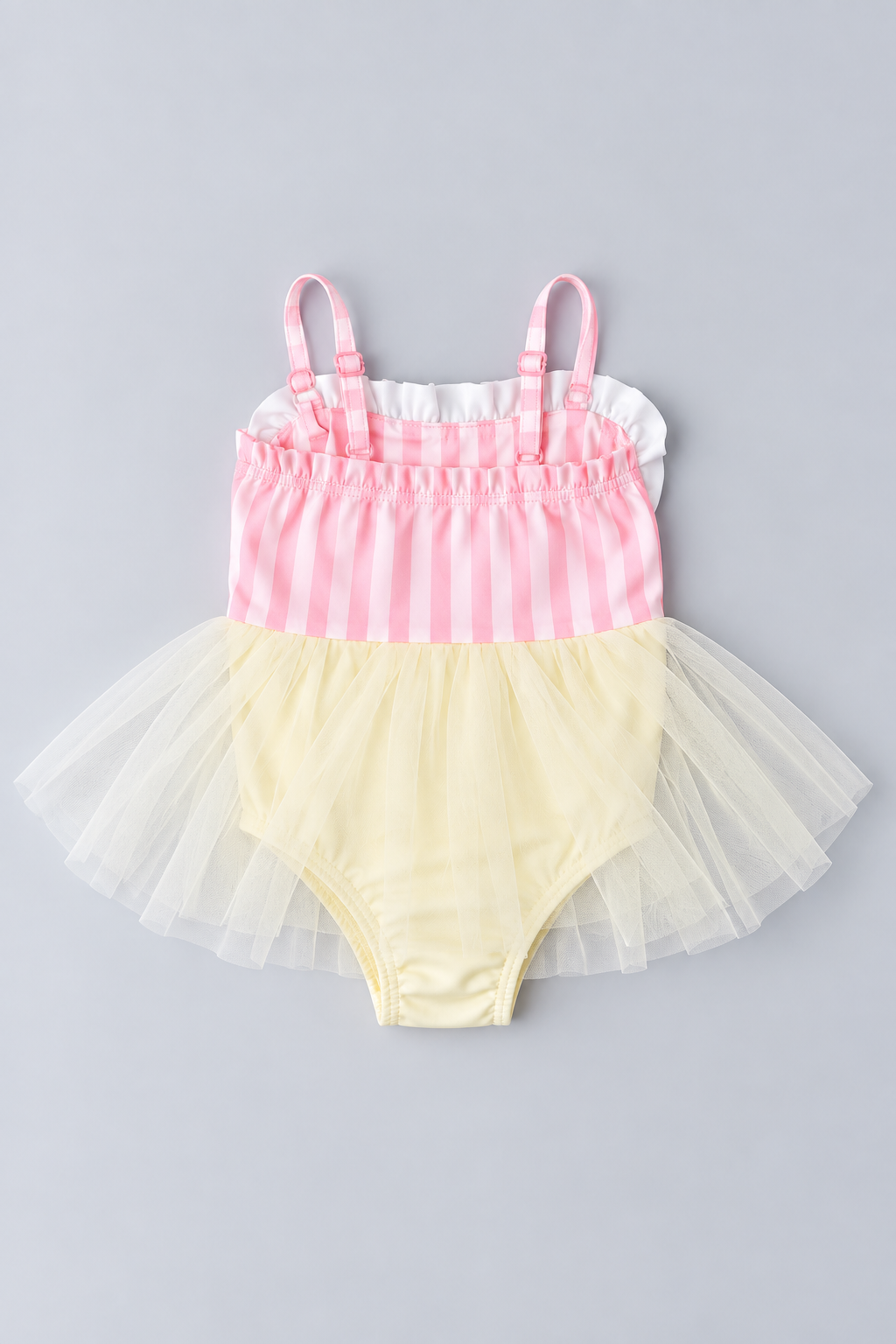 Back view of pink and ivory striped toddler one-piece swimsuit with adjustable shoulder straps and layered ivory tulle tutu.