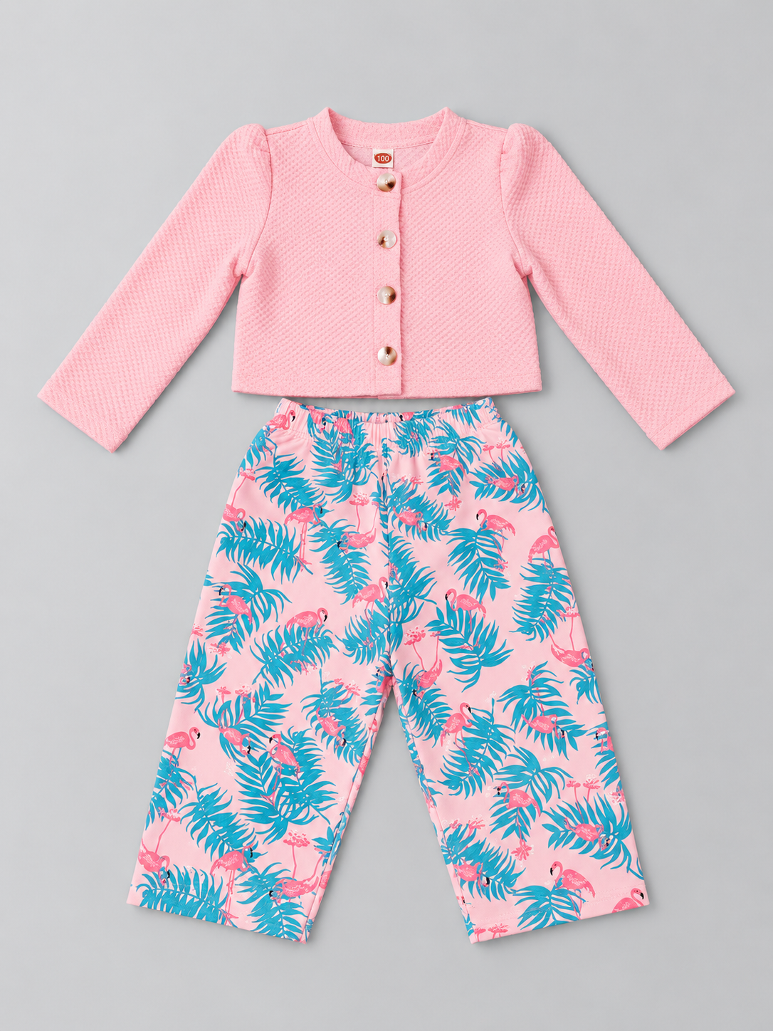 Girls pink two-piece outfit with textured pearl-button top and tropical flamingo wide-leg pants, front view