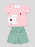 Shop this adorable girls’ 2-piece outfit featuring a pink kitty graphic top with ruffled shoulders and coordinating mint green bow shorts. A sweet and comfortable choice for everyday wear