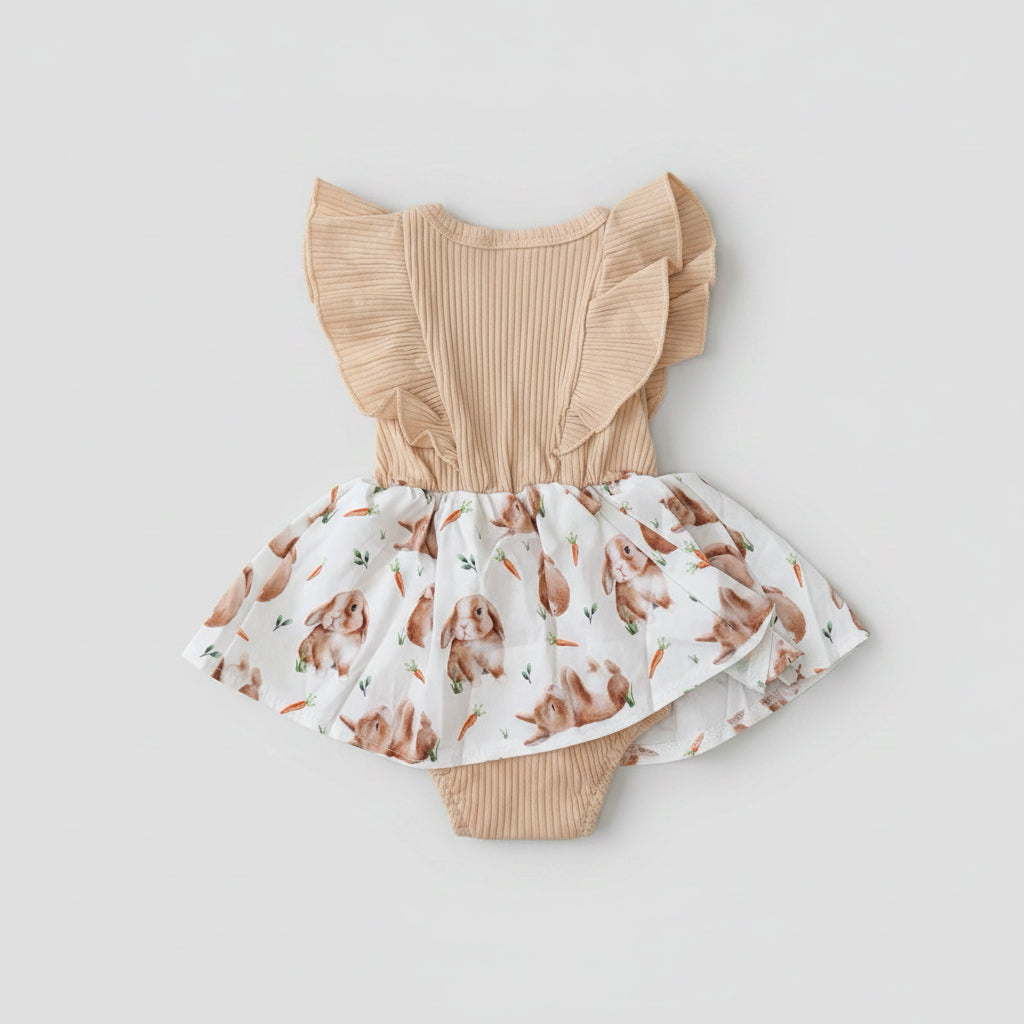 Adorable Baby Girls Bunny Print Dress Romper featuring flutter sleeves, a soft ribbed bodice, bunny print skirt, and built-in romper. Perfect for Easter, spring, birthdays, and everyday boutique style.