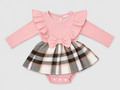 Shop the adorable Pink Plaid Bow Long Sleeve Dressy Romper featuring a ribbed pink top, ruffle details, statement bow, and attached plaid skirt for a sweet boutique-inspired look.