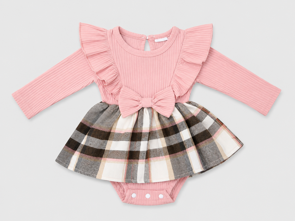 Shop the adorable Pink Plaid Bow Long Sleeve Dressy Romper featuring a ribbed pink top, ruffle details, statement bow, and attached plaid skirt for a sweet boutique-inspired look.