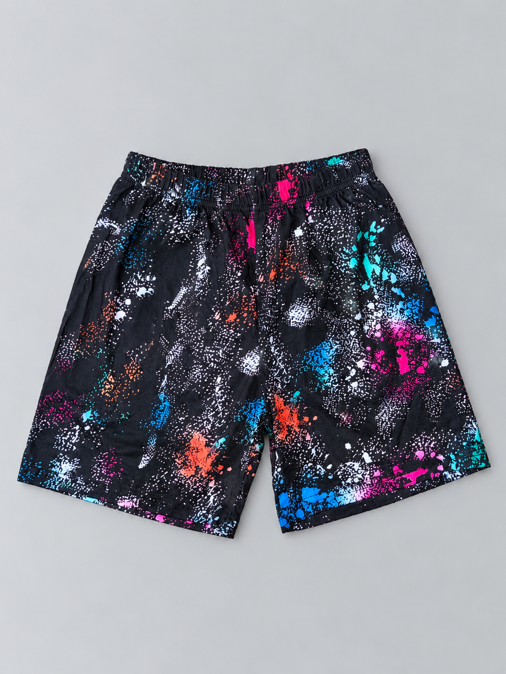 Kids black shorts with multicolor abstract paint-splatter print and elastic waistband, front view
