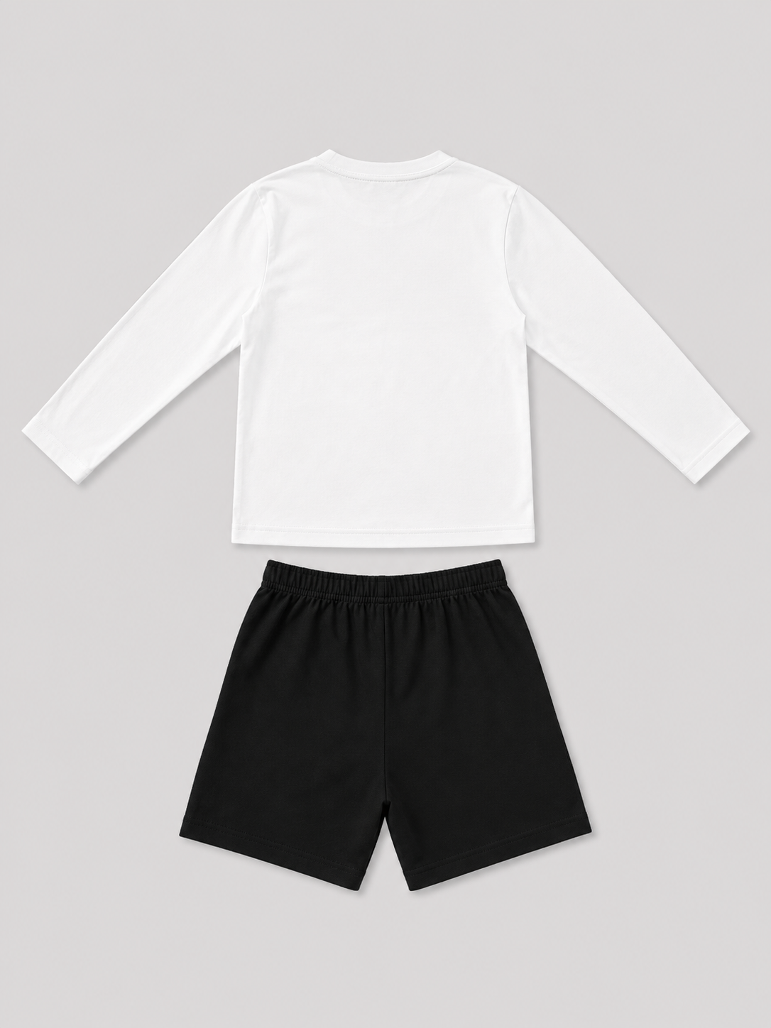 Boys white long-sleeve shirt and solid black shorts two-piece outfit, back view, size 5–6Y.
