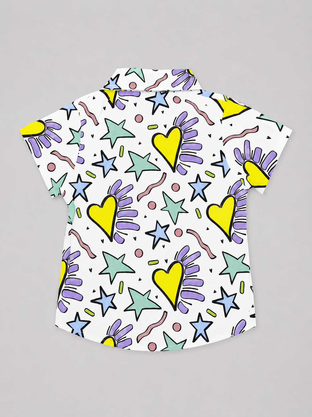 Shop this colorful Hearts & Stars Pattern Boys’ Short Sleeve Shirt featuring bright hearts, stars, and playful geometric details on a white button-up collared shirt. 100% Cotton.