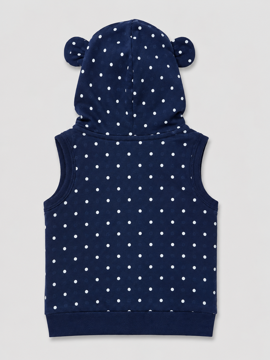A navy blue sleeveless hooded vest with white polka dots and bear ears on the hood, shown from the back against a light gray background.