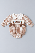 Brown and cream gingham Thanksgiving baby bubble romper with white Peter Pan collar, Gobble turkey embroidery, brown bows and long puff sleeves.