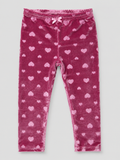 Girls' blush pink velvet leggings featuring an embossed heart design, stretchy fit, and soft plush fabric. Perfect for Valentine's Day, holidays, and cozy fall and winter outfits.