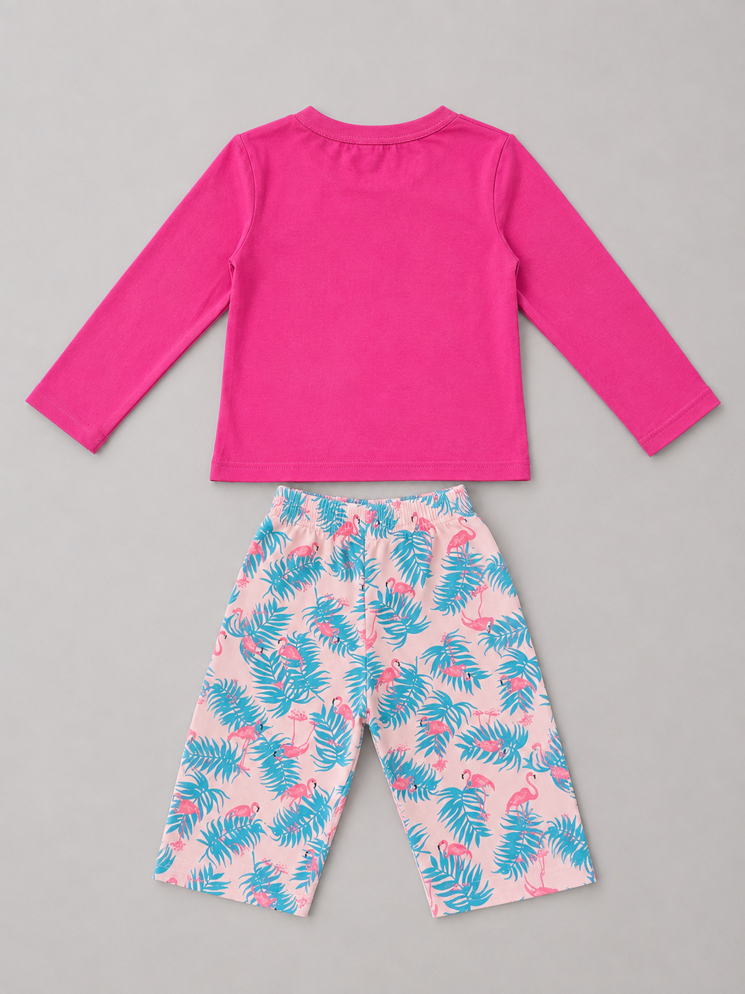 Shop this adorable girls 2-piece outfit set featuring a bright pink long-sleeve top and tropical flamingo and leaf print pants. A fun and colorful choice for everyday wear.