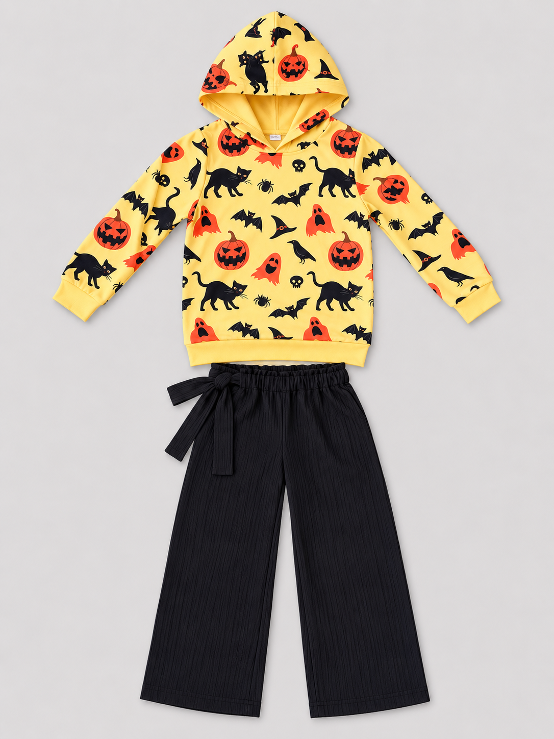 Girls yellow Halloween print hoodie and black wide-leg pants two-piece outfit, front view