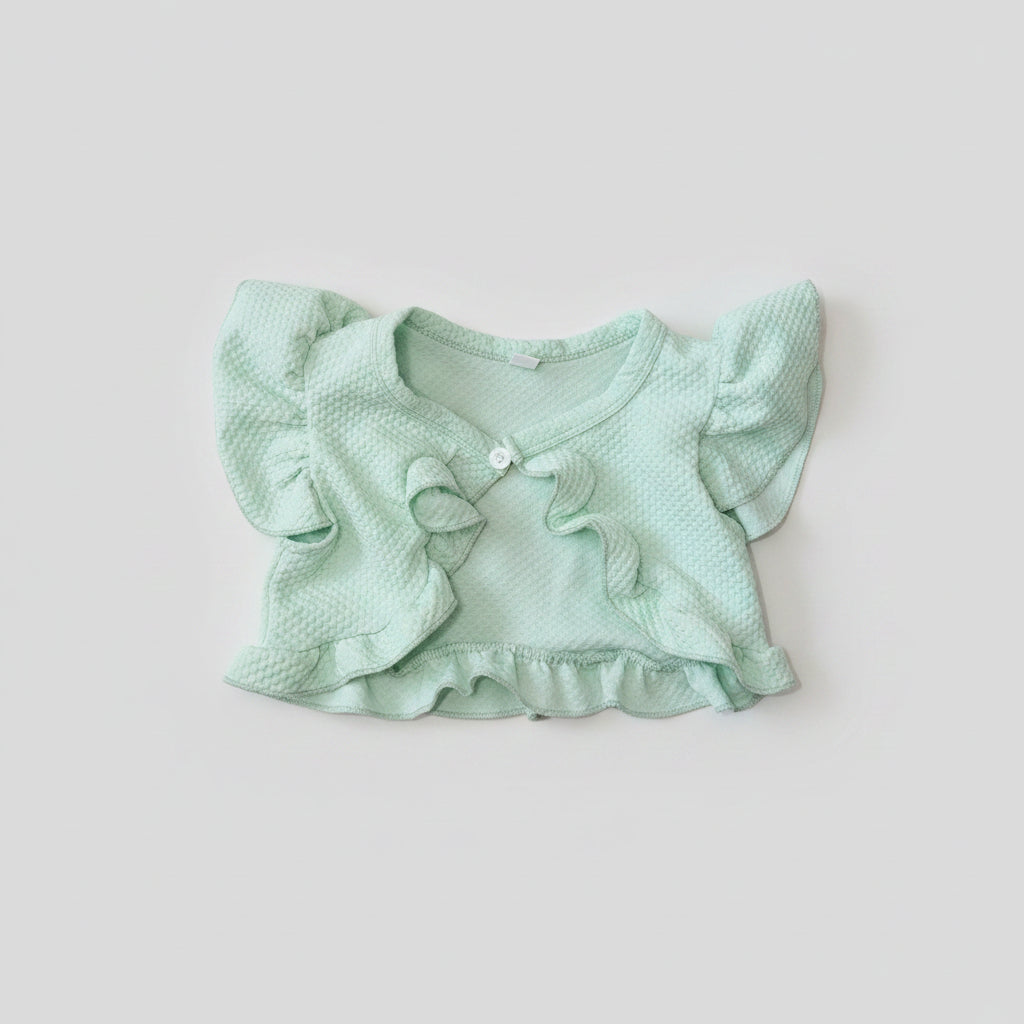 A baby girl's pale mint green textured romper shrug with ruffled sleeves, a ruffled bow detail on the chest, and a button closure.