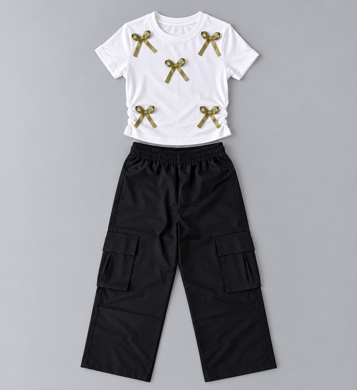 Girls white bow accent top with ruched elastic sides and black wide-leg cargo pants two-piece outfit