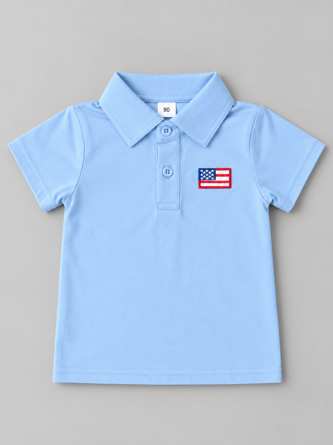 Boys light blue short sleeve polo shirt with embroidered American flag chest patch