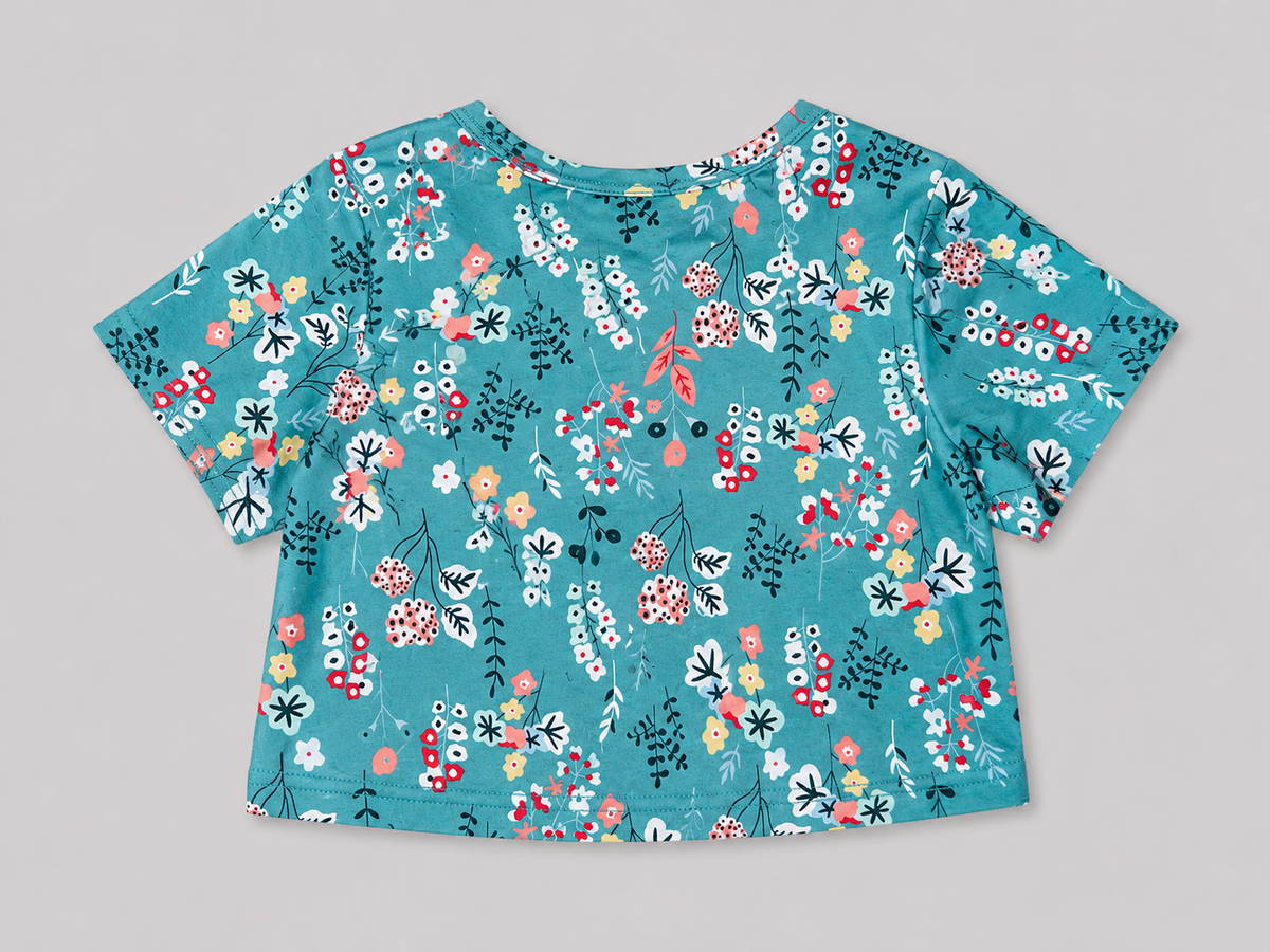 Girls' teal floral print short-sleeve top featuring a colorful botanical pattern and comfortable everyday style.  perfect for school, casual outings, spring, summer, and everyday wear.