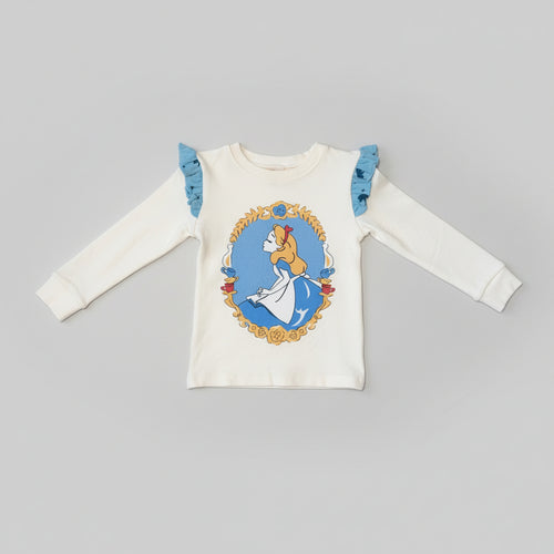 Ivory toddler long-sleeve top featuring an Alice in Wonderland character graphic with blue ruffle shoulder accents.