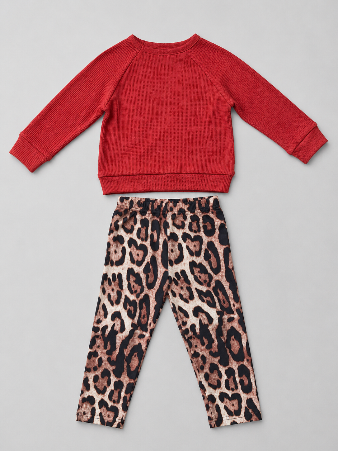 Adorable girls 2-piece outfit featuring a cozy waffle-knit bear sweatshirt and trendy leopard print leggings. Perfect for fall, winter, school, playdates, and everyday boutique fashion.