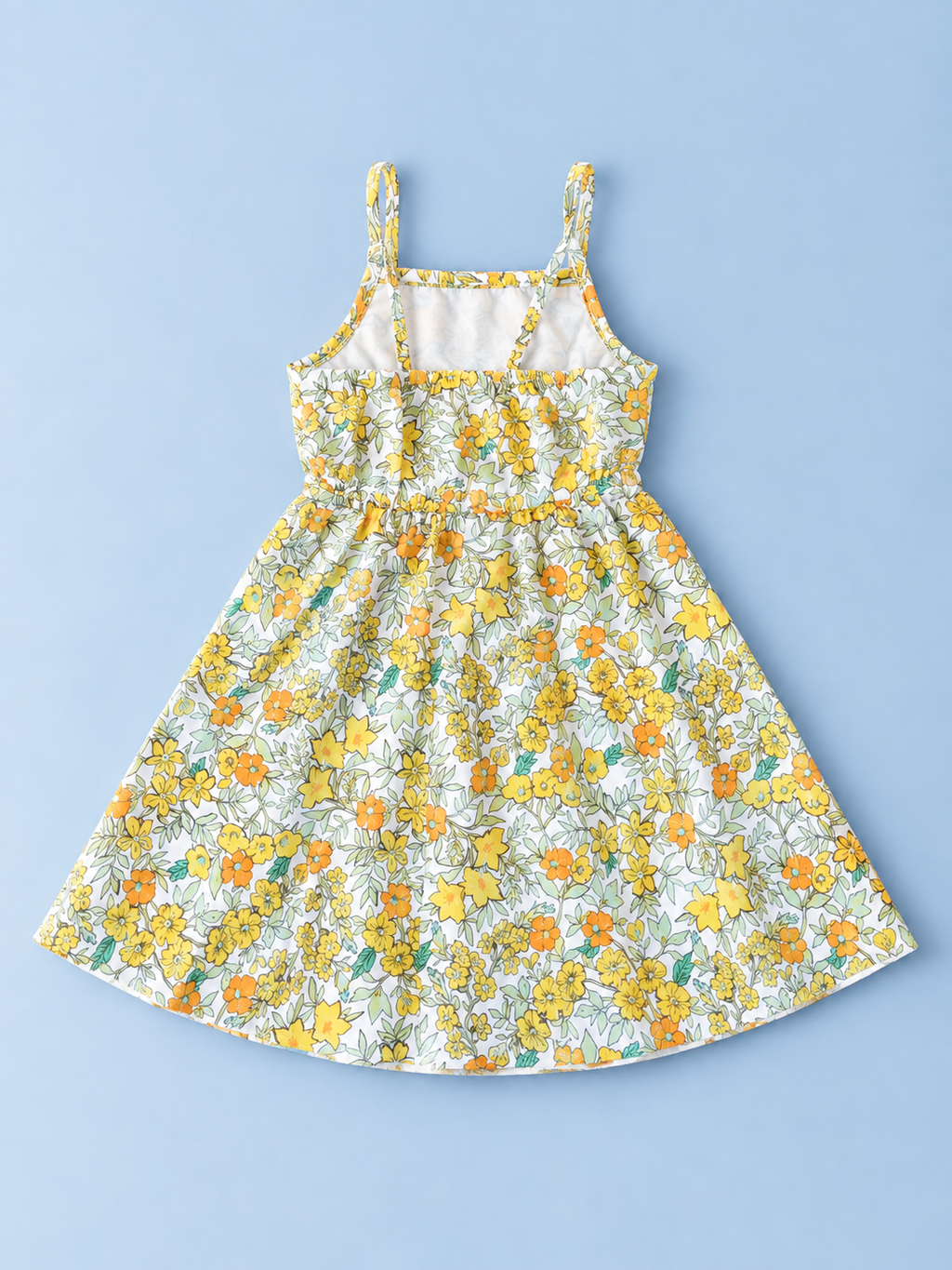 Back view of girls yellow and orange floral sundress with gathered waist and full flared skirt