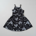 Girls Black Heart Print Ruffle Dress featuring adjustable spaghetti straps, playful heart graphics, and a comfortable twirl-worthy fit. Perfect for everyday wear, Valentine's Day, parties, and special occasions.