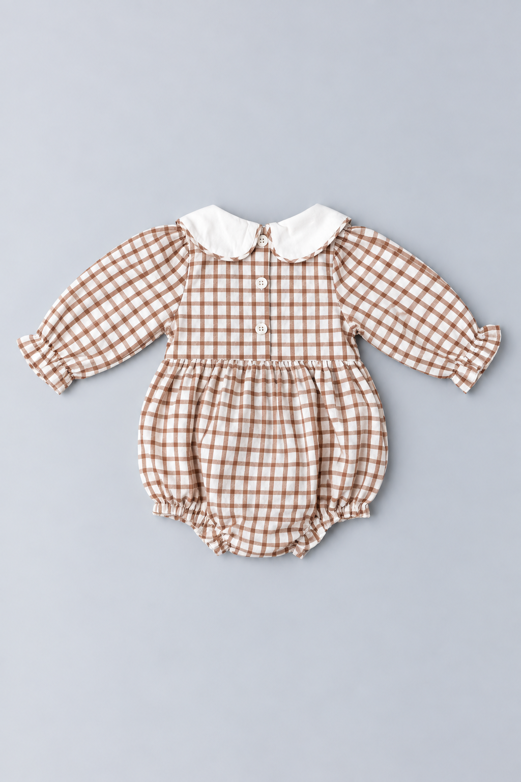 Back view of brown and cream gingham Thanksgiving baby bubble romper with white Peter Pan collar, button closures and gathered bubble bottom.