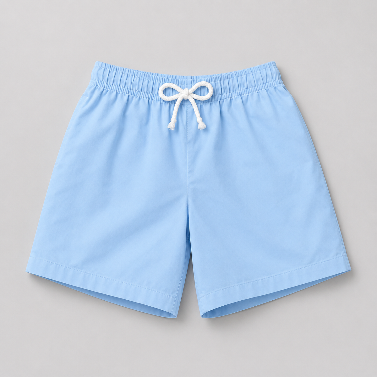 Shop these classic light blue kids' shorts featuring an elastic waistband and white drawstring. A comfortable and versatile everyday style perfect for boys or girls.