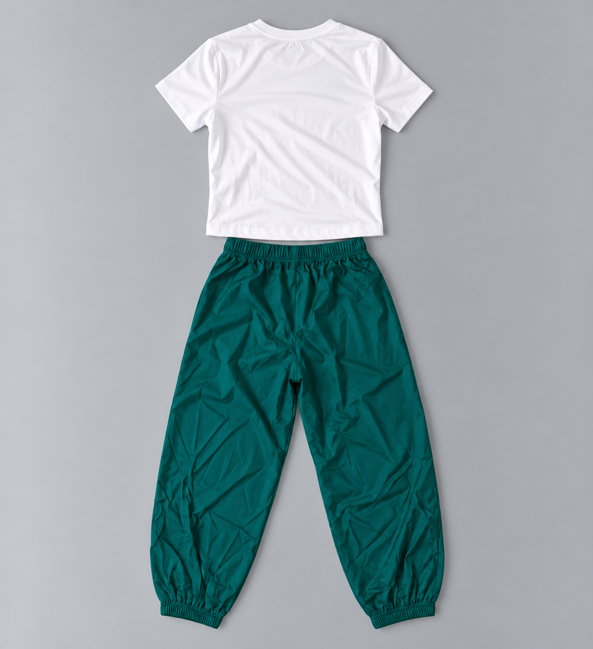 Back view of girls white short-sleeve tee and deep green elastic-waist jogger pants set