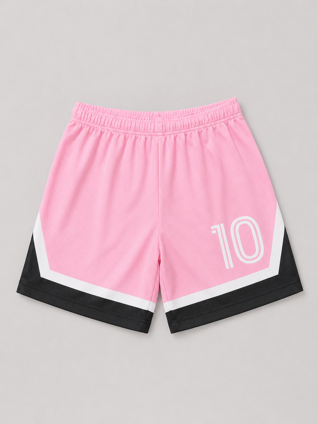 Pink and black girls' athletic shorts featuring a bold number 10 graphic, elasticized waistband, and sporty color-blocked design. Perfect for active play, casual wear, and summer outfits.