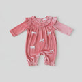 Dress your little one in elegance with this Baby Girls Pink Velvet Bow Ruffle Romper. Featuring soft velvet fabric, delicate bow appliqués, ruffle details, and a comfortable fit for special occasions.