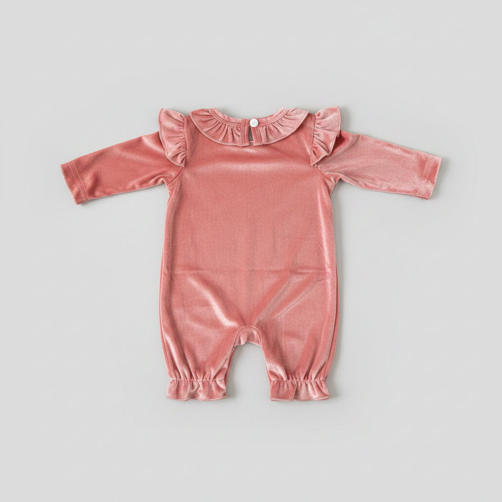 Back side of Dress your little one in elegance with this Baby Girls Pink Velvet Bow Ruffle Romper. Featuring soft velvet fabric, delicate bow appliqués, ruffle details, and a comfortable fit for special occasions.