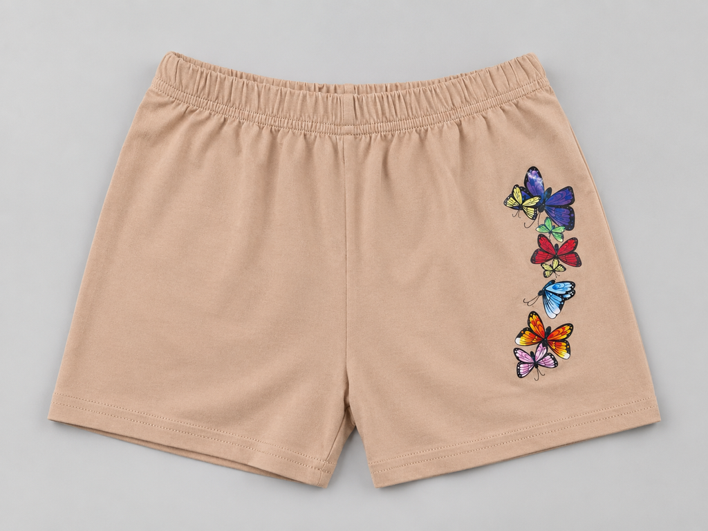 Shop these adorable tan girls shorts featuring a colorful butterfly graphic. A fun and comfortable choice for everyday wear, playtime, outings, and pairing with favorite tops.