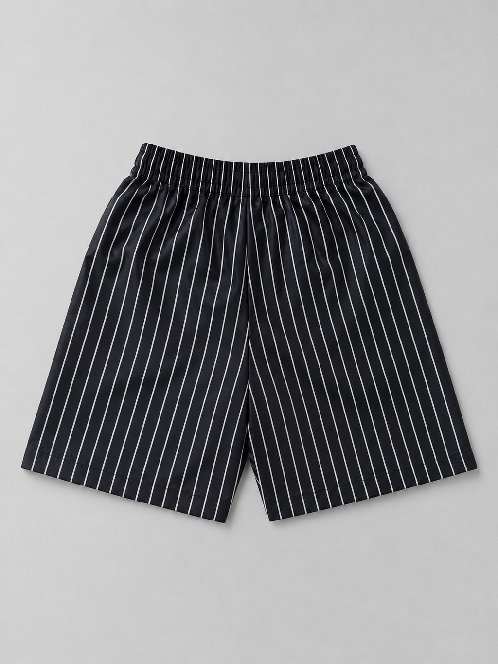 Shop these stylish black and white pinstripe kids shorts featuring an elastic waistband and adjustable drawstring. A versatile unisex style perfect for boys and girls, everyday wear, outings, and casual outfits.