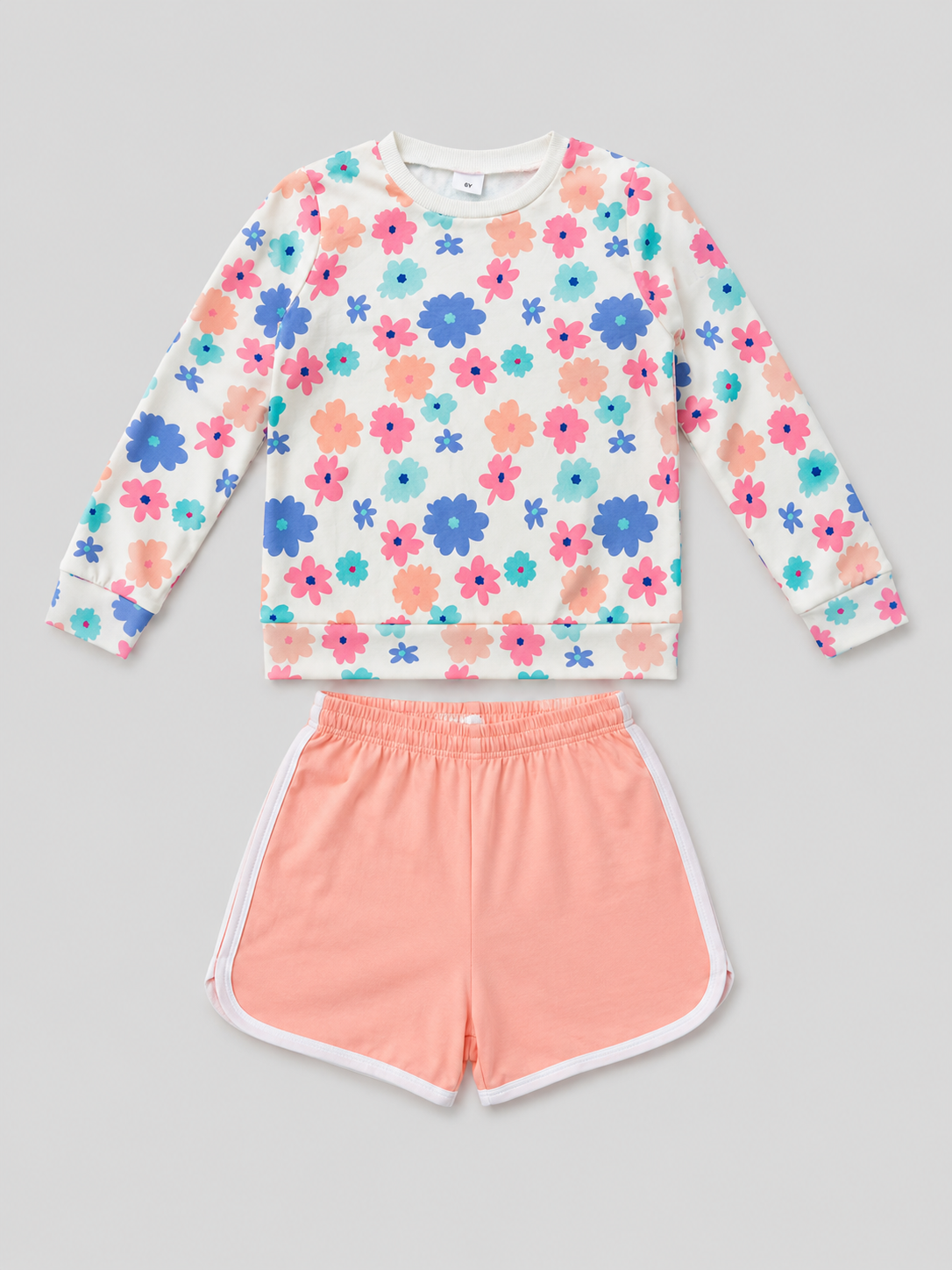 Shop this adorable girls’ two-piece set featuring a colorful floral long-sleeve top and coral shorts with white trim. Perfect for everyday wear, playdates, casual outings, and warm-weather activities.

