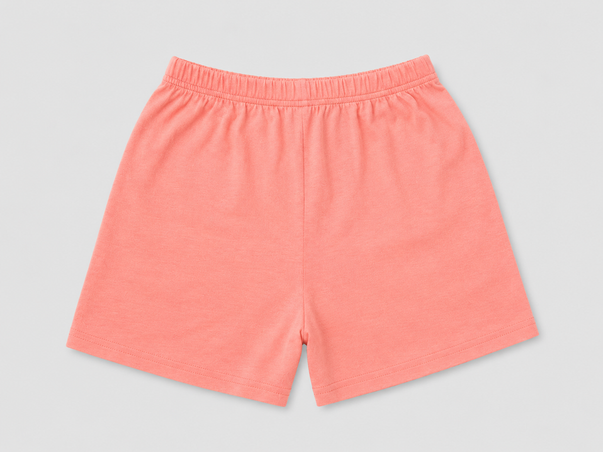 Shop these fun kids’ coral shorts featuring a colorful yellow dinosaur graphic and comfortable elastic waistband. Perfect for summer, playtime, casual outings, and everyday wear.