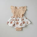 Adorable Baby Girls Bunny Print Dress Romper featuring flutter sleeves, a soft ribbed bodice, bunny print skirt, and built-in romper. Perfect for Easter, spring, birthdays, and everyday boutique style.