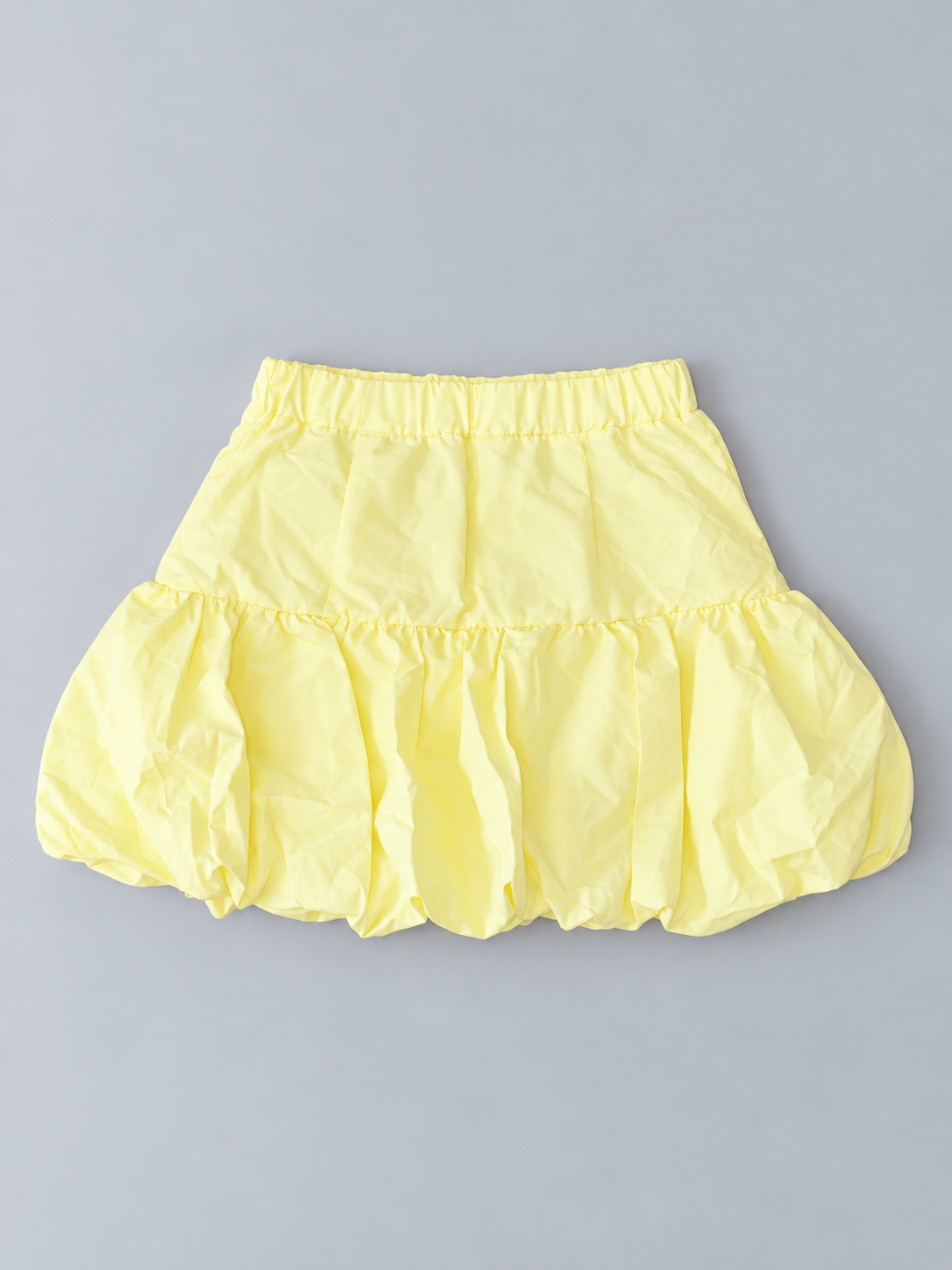 Girls pale yellow bubble-hem skirt with elasticized waistband and gathered voluminous hem