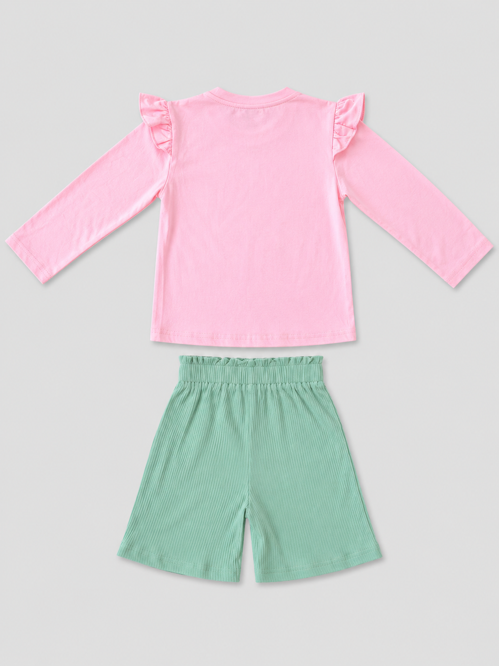 Shop this adorable girls’ unicorn 2-piece outfit featuring a pink long-sleeve top with a colorful unicorn graphic and coordinating mint green bow shorts. Perfect for everyday wear and special occasions.