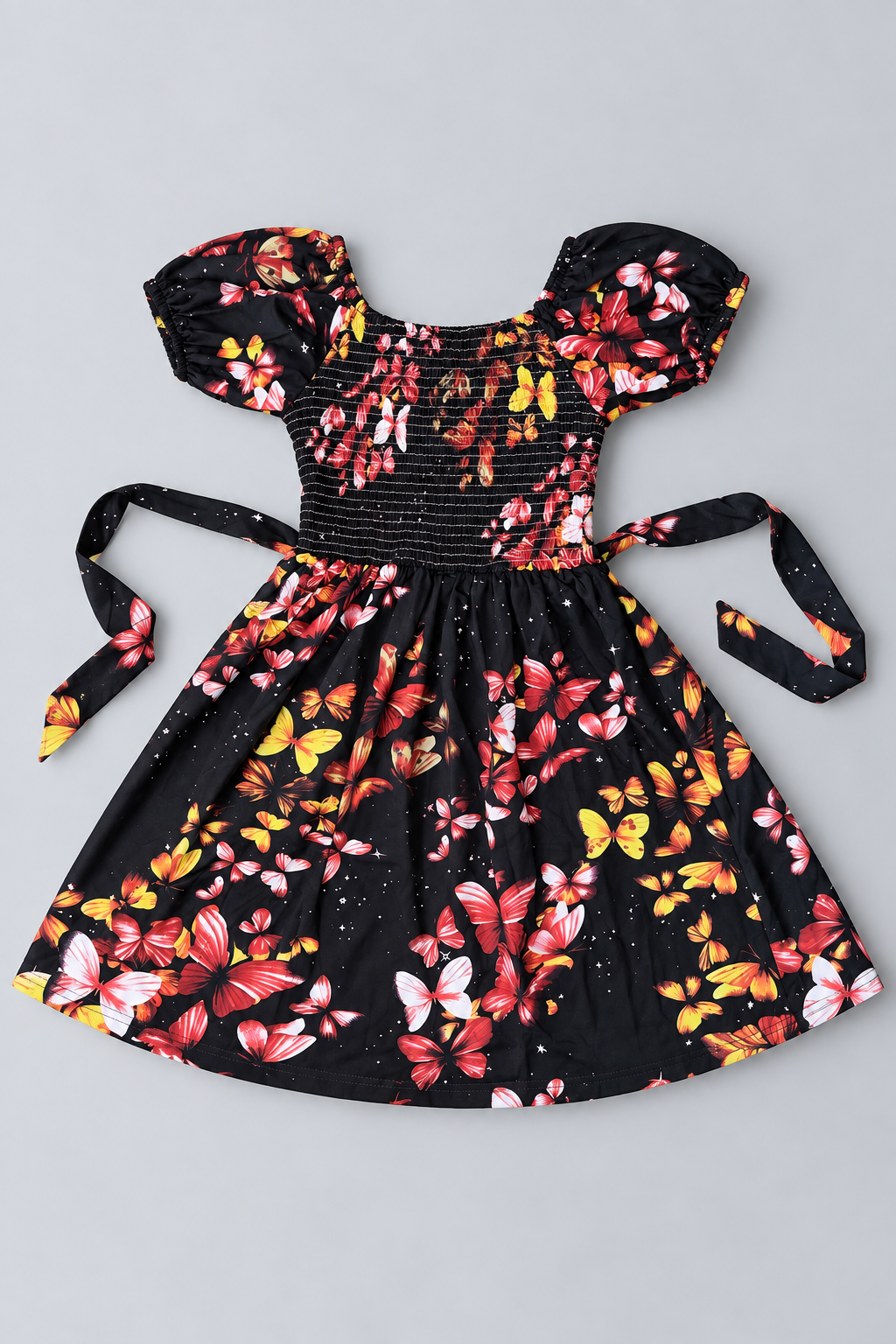 Girls black butterfly print dress with colorful butterflies, smocked bodice, puff sleeves, tie waist and full skirt