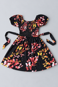 Girls black butterfly print dress with colorful butterflies, smocked bodice, puff sleeves, tie waist and full skirt