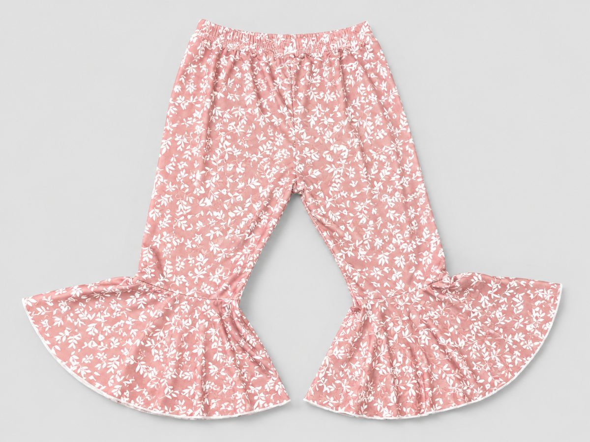 Girls dusty rose floral bell bottom pants featuring a beautiful white botanical print, soft stretchy fabric, and a trendy boho flare design. Perfect for everyday wear, special occasions, and boutique-style outfits.