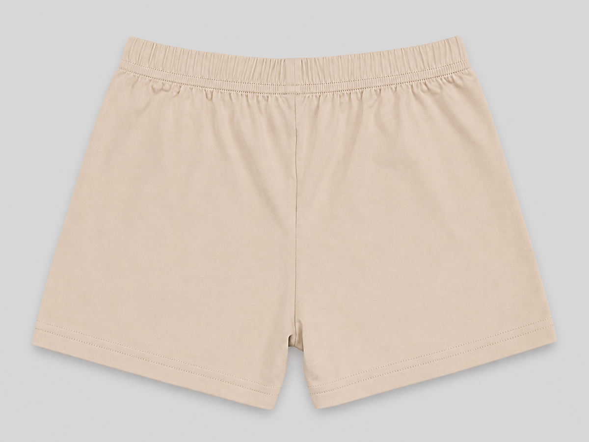 A pair of light beige elastic-waist shorts laid flat against a neutral gray background.