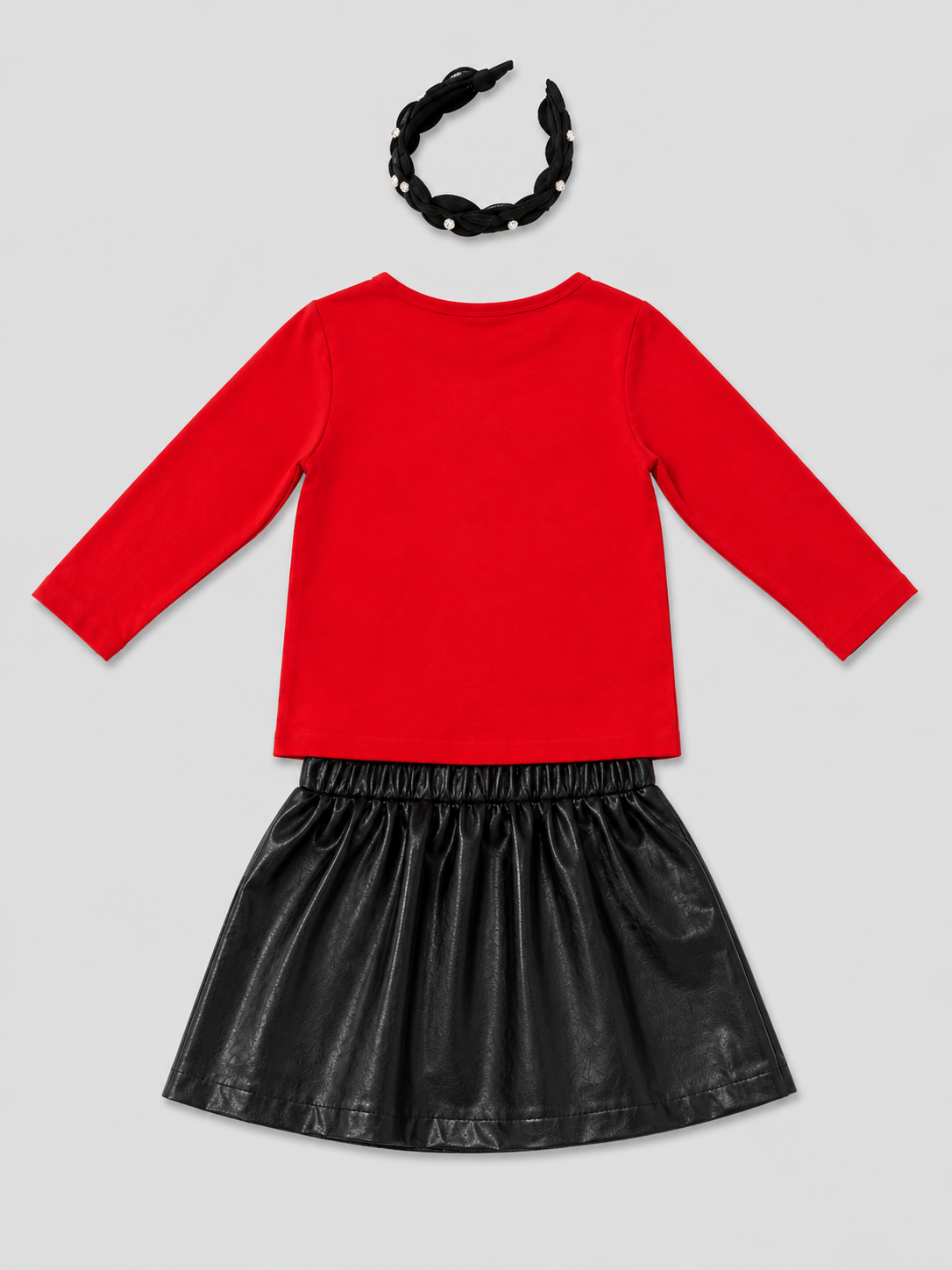 Shop this adorable 3-piece girls Christmas outfit set featuring a festive red reindeer top, black faux leather skirt, and embellished pearl headband. Perfect for holiday parties and Christmas photos!