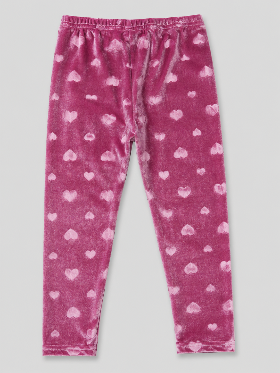 Girls' blush pink velvet leggings featuring an embossed heart design, stretchy fit, and soft plush fabric. Perfect for Valentine's Day, holidays, and cozy fall and winter outfits.