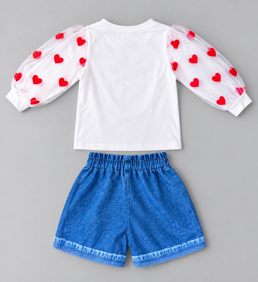 Back view of girls white tulle sleeve top and blue elastic waist denim-look shorts set