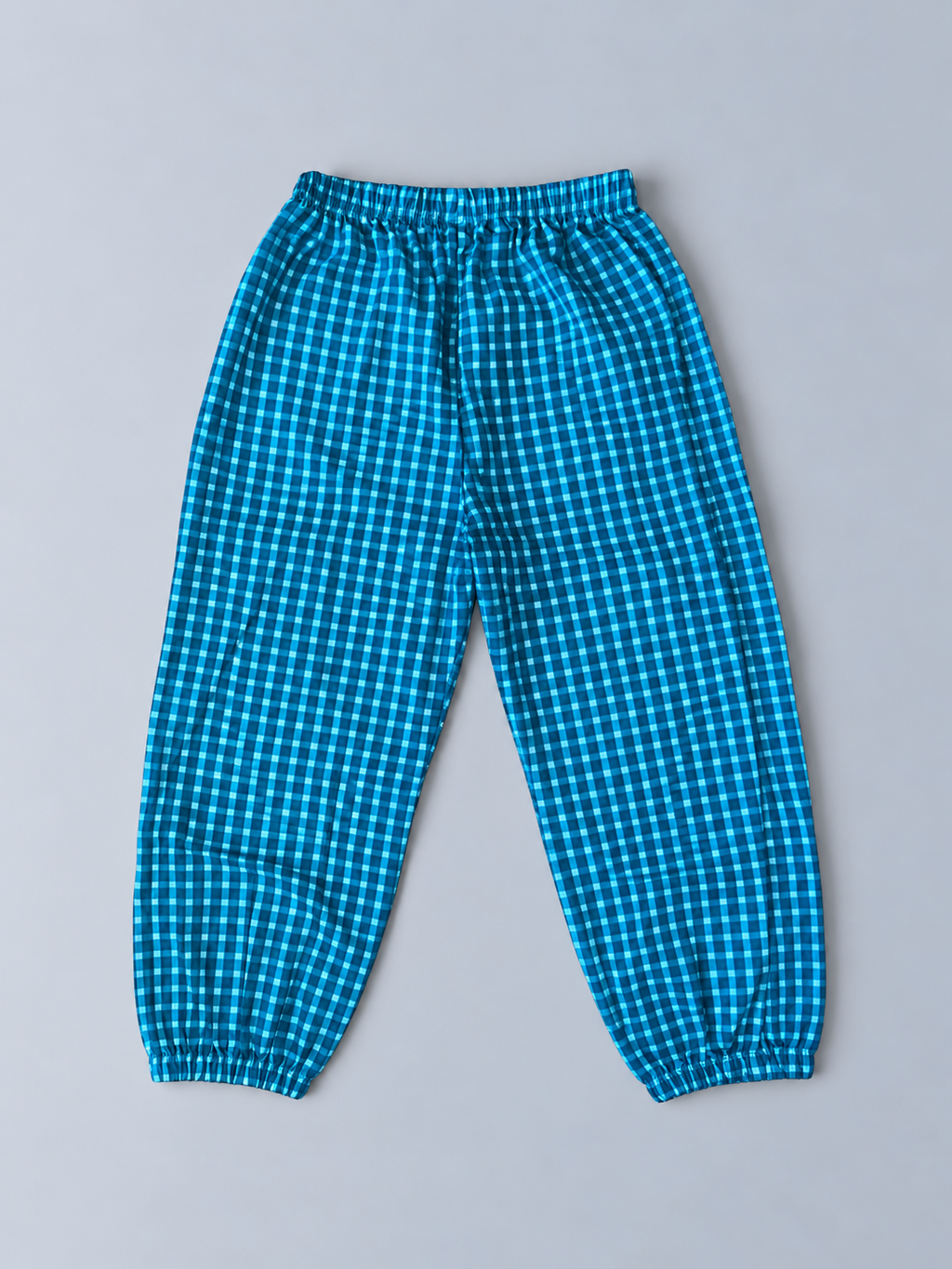 Girls blue gingham check jogger pants with elastic waist and gathered ankle cuffs